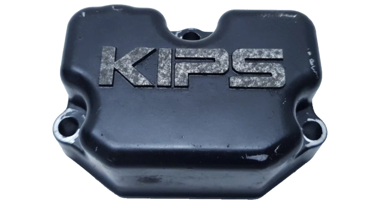 Cache valve gauche Kawasaki KMX 125 1988 Réf : 140901506